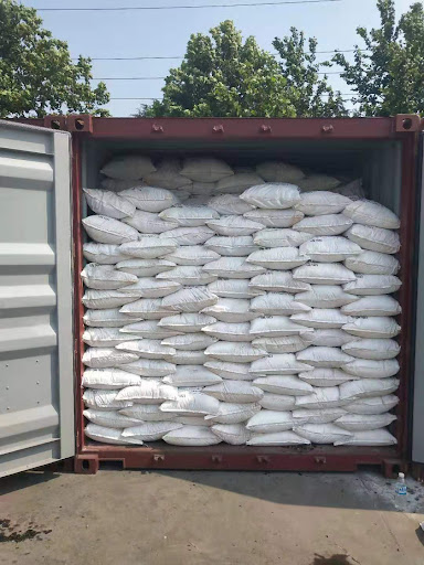 Caustic Soda Flakes loading into container 1.png